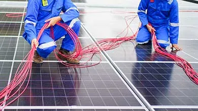 Two works setting up wires