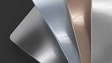 Four glossy rectangular panels in silver, pale blue, rose gold, and white overlap in a fan shape on a dark gray background, each showing a different metallic or reflective finish.